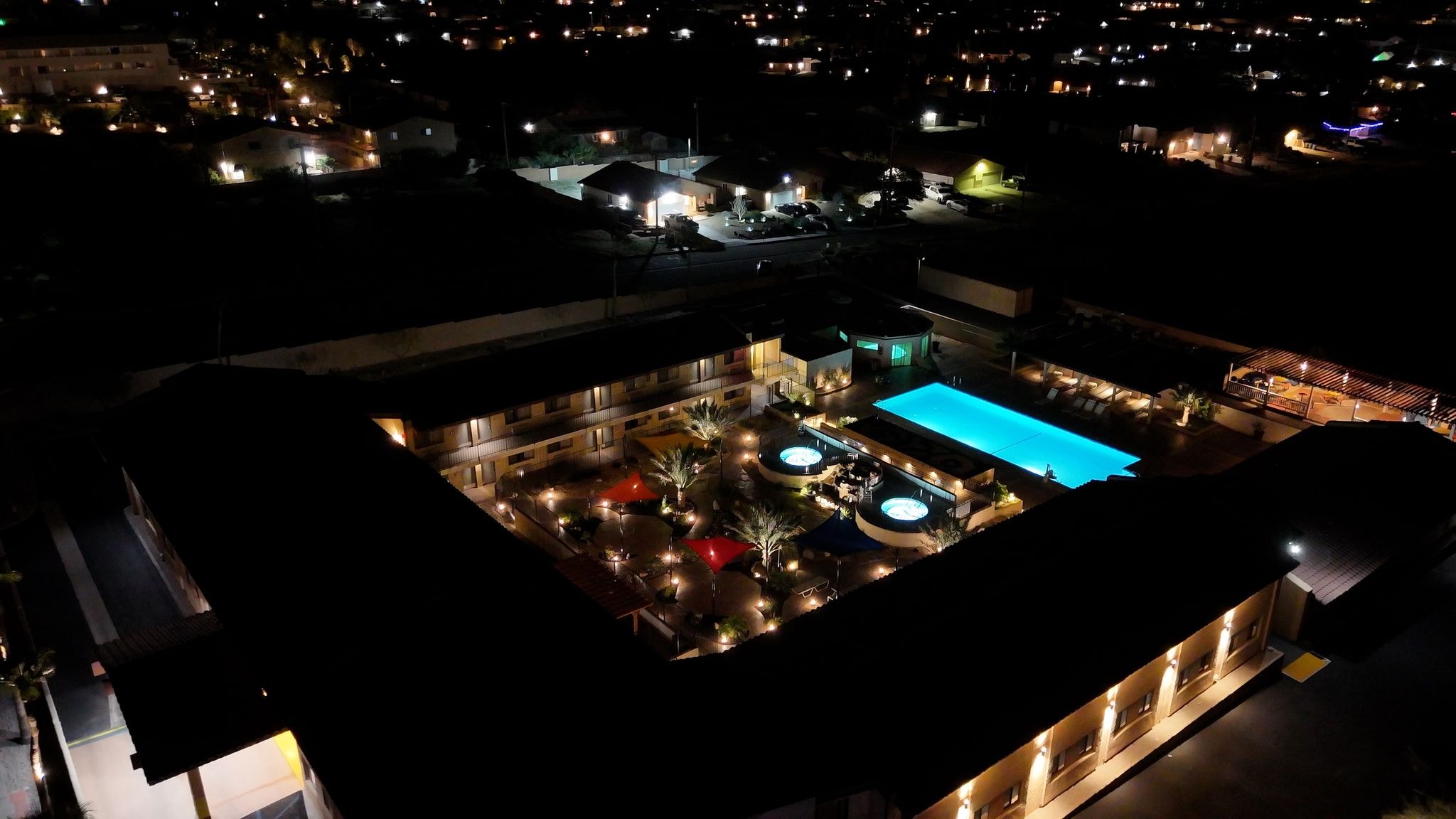 Resort pool and grounds at night