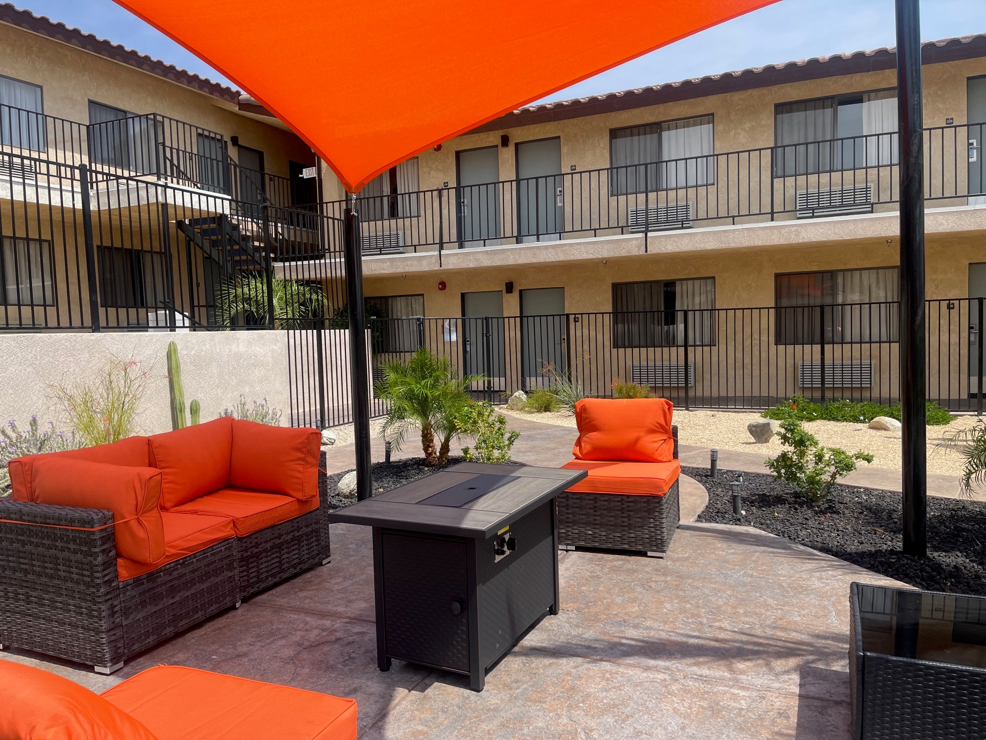 Cozy fire pit courtyard seating area at Relax Hotel Spa