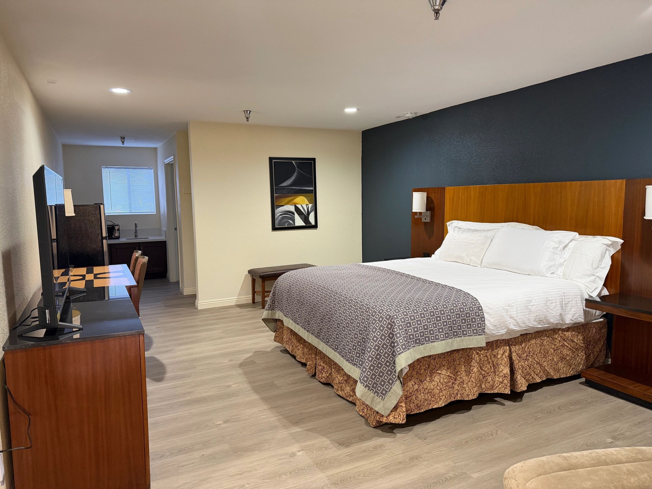 Modern king bedroom with wood headboard